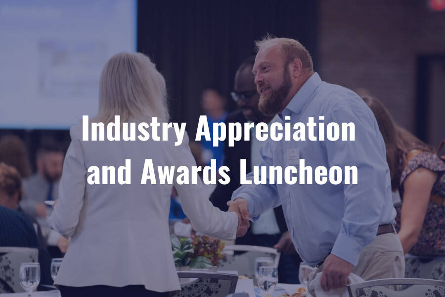 Handshake reflects appreciation at the awards luncheon.